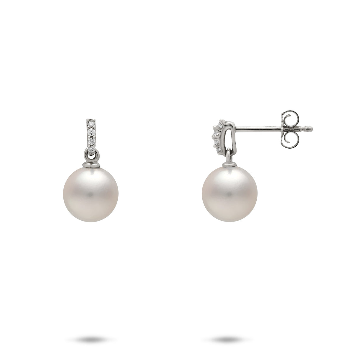 A pair of 14k white gold dangle stud earrings with a vertical row of diamonds atop a Akoya white pearl, shown with a front and side view of the butterfly backing, on a white background