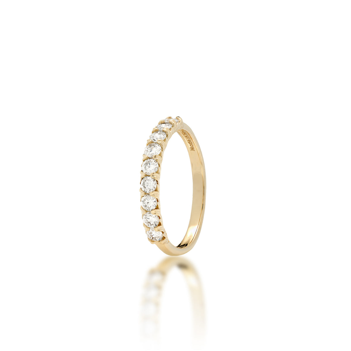 A 3mm 14k yellow gold anniversary ring featuring a row of Lab Grown Diamonds with maile leaf detailed prongs shown on a white background