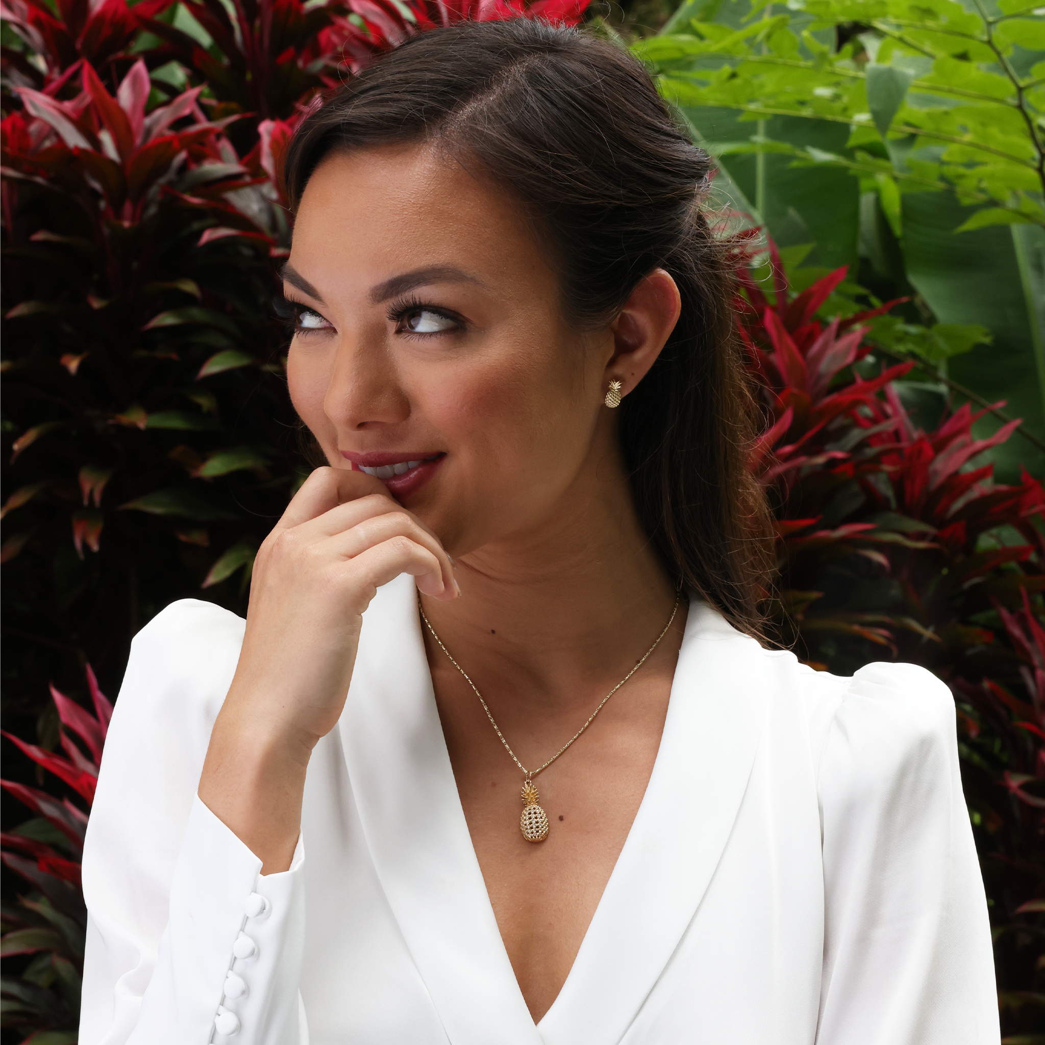 A woman wearing a Pineapple Pendant in Gold with Diamonds - Maui Divers Jewelry