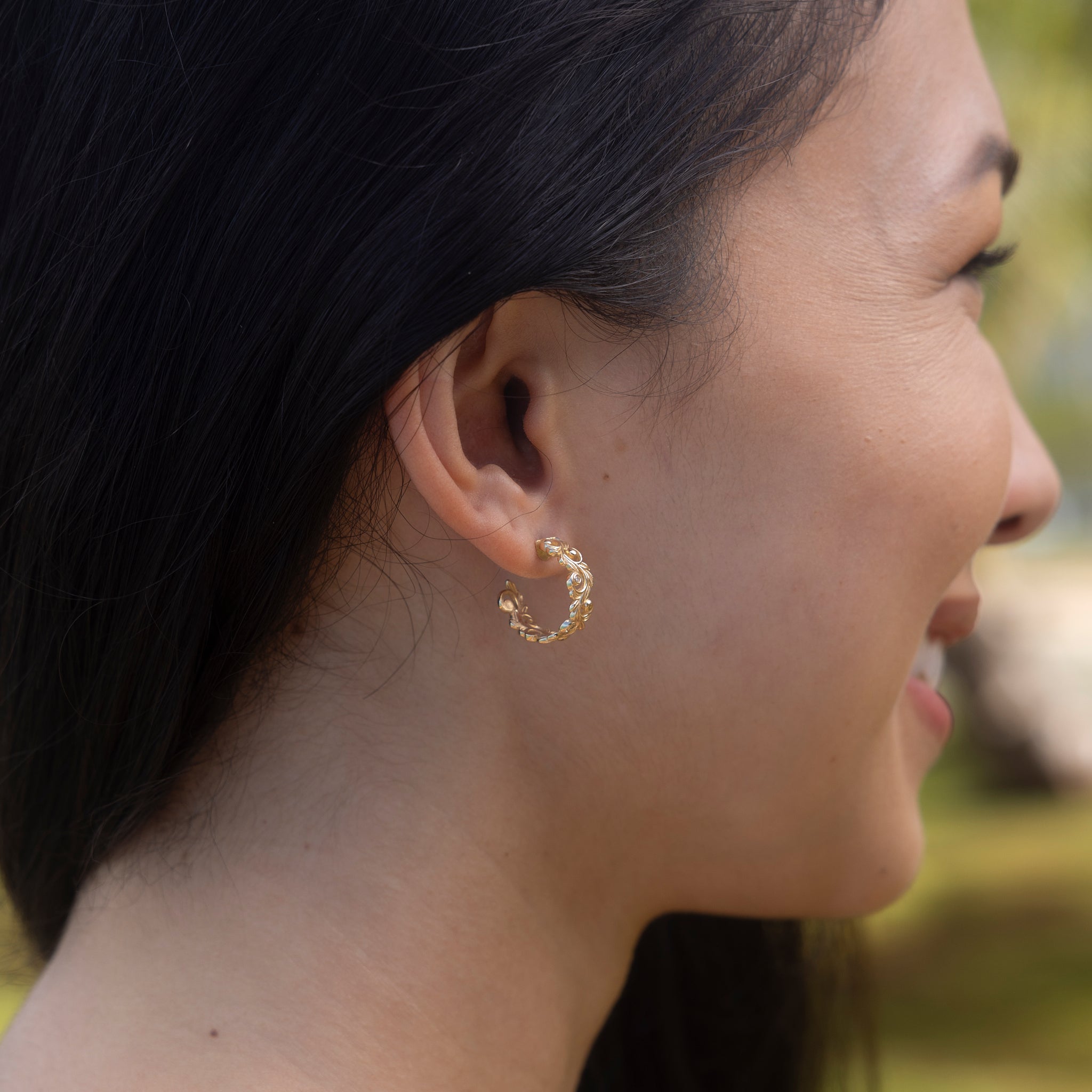 Close up of a woman wearing Living Heirloom Hoop Earrings in Gold with Diamonds