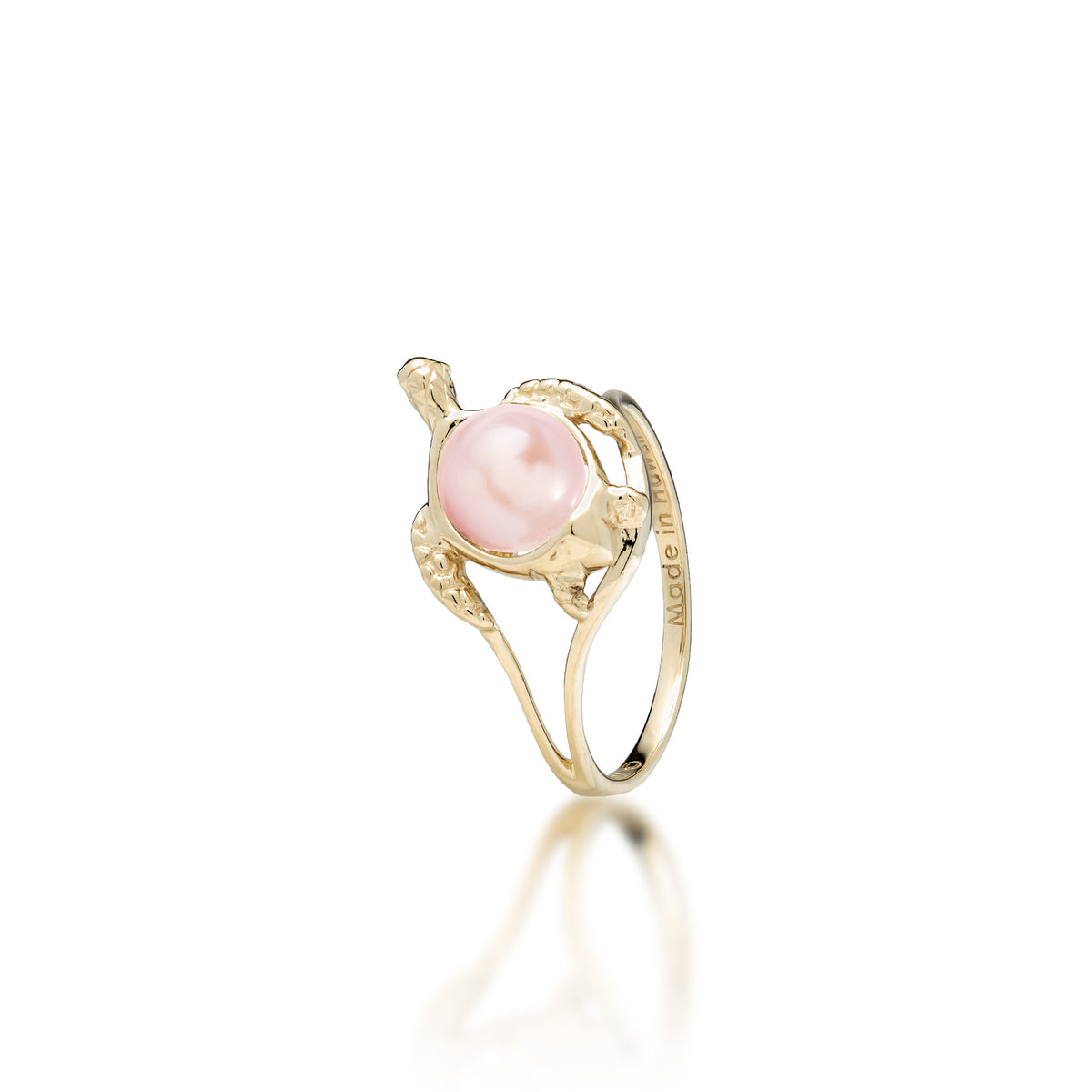 A 14k yellow gold sea turtle ring with a pink freshwater pearl as its shell, shown on a white background
