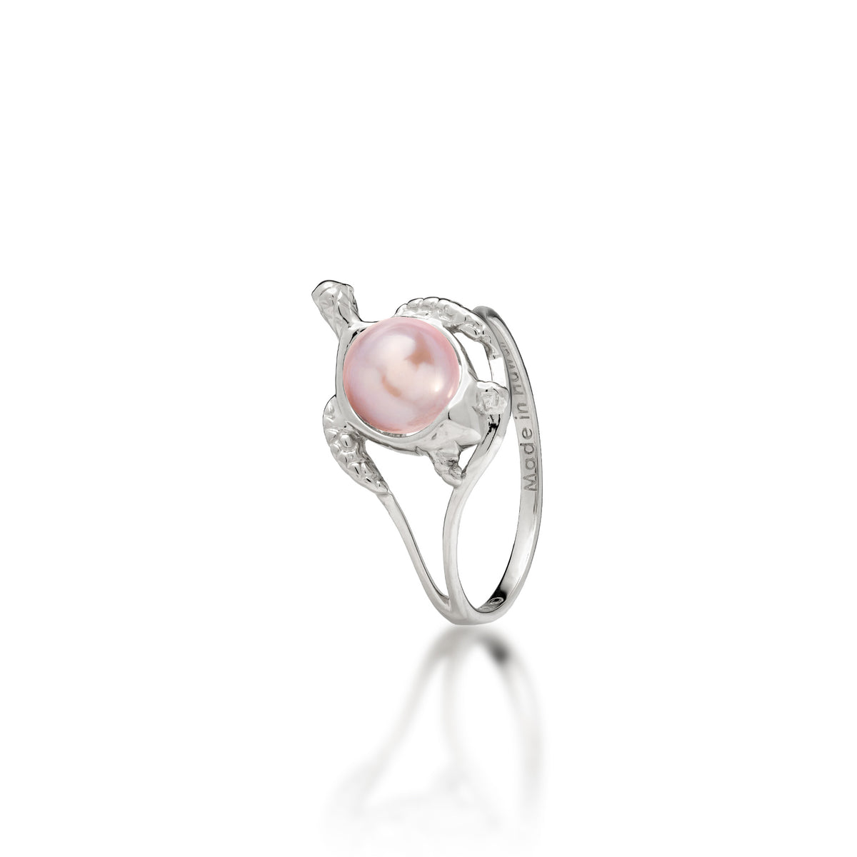 A 14k white gold sea turtle ring with a lavender freshwater pearl as its shell, shown on a white background