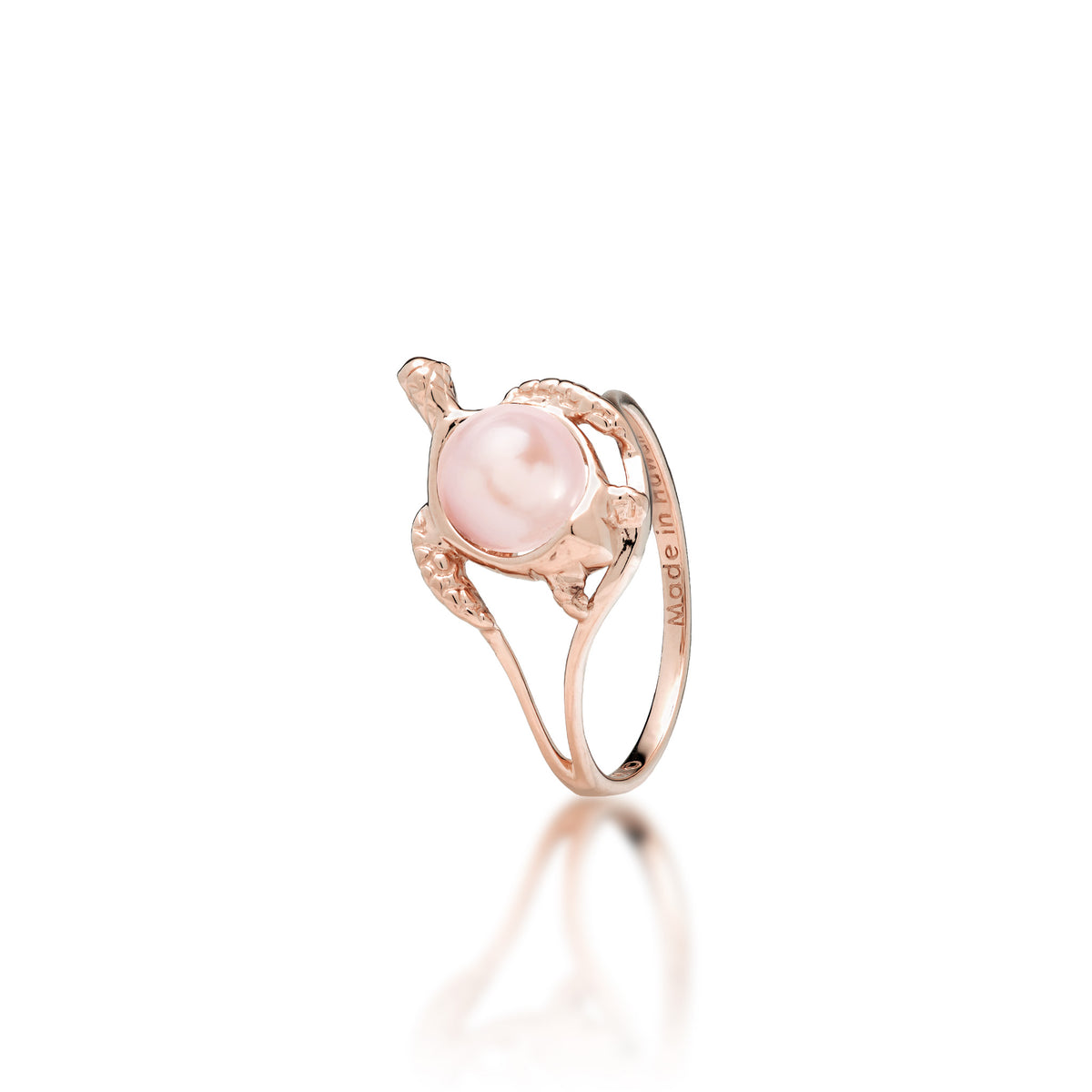 A 14k rose gold sea turtle ring with a pink freshwater pearl as its shell, shown on a white background