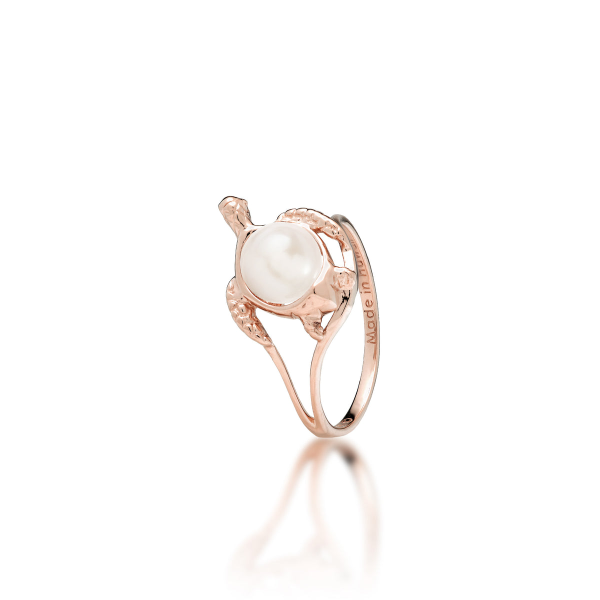 A 14k rose gold sea turtle ring with a white freshwater pearl as its shell, shown on a white background