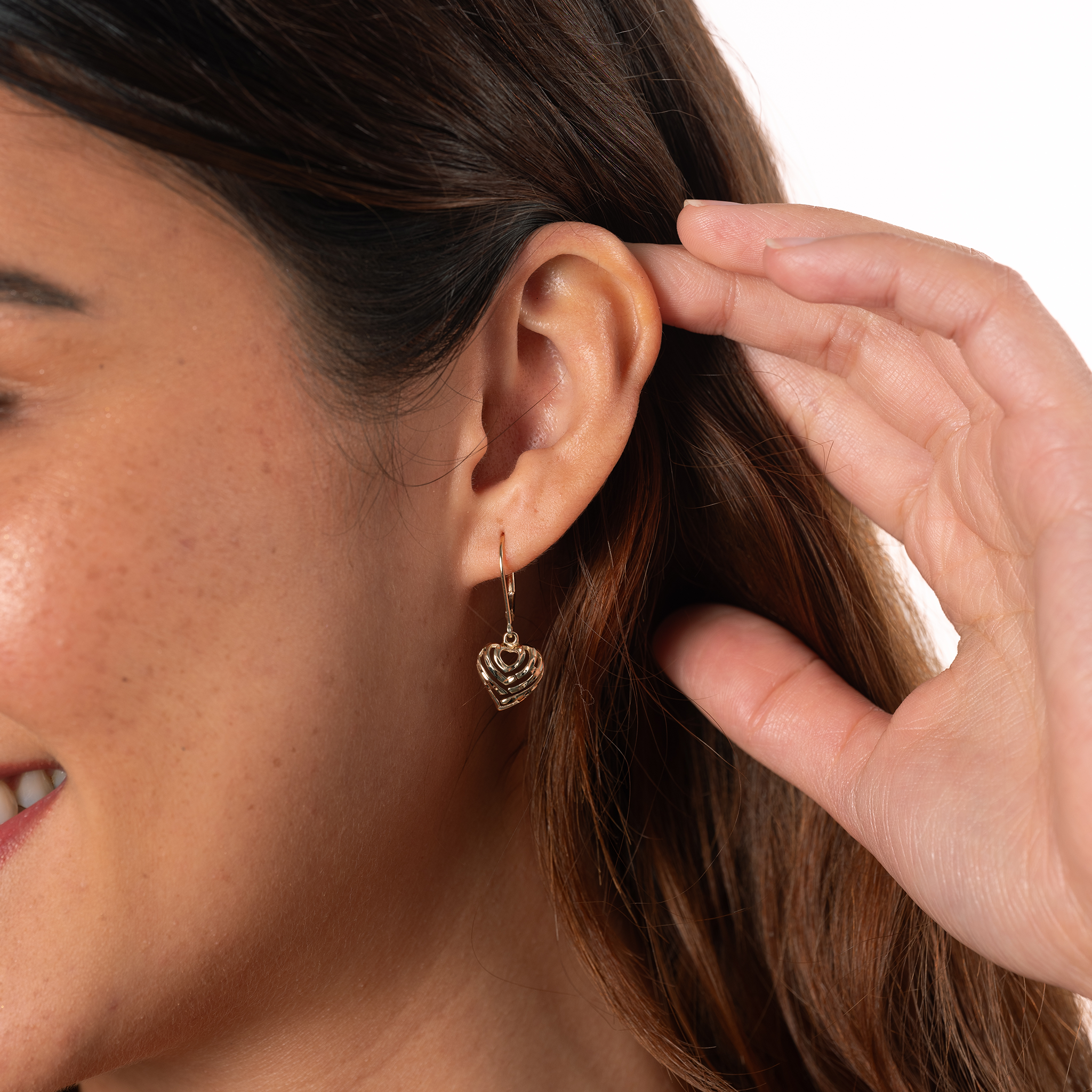 Close up of woman's ear in a studio wearing 11mm Aloha Heart Leverback Earrings
