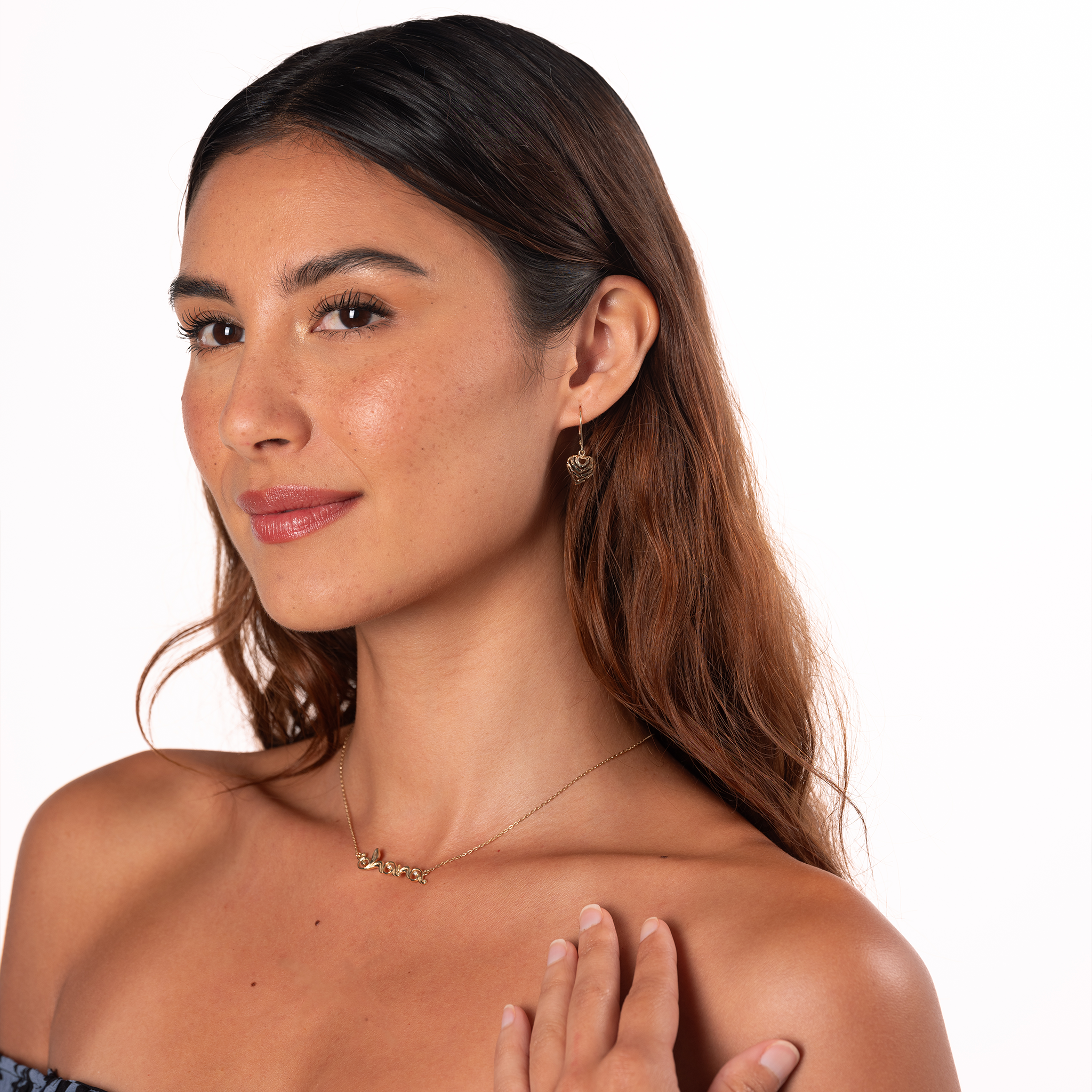 Woman in a studio on a white background wearing 11mm Aloha Heart Leverback Earrings