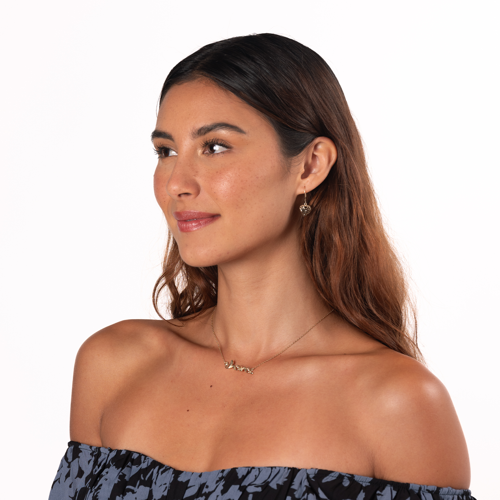 Woman in a studio on a white background wearing 11mm Aloha Heart Leverback Earrings