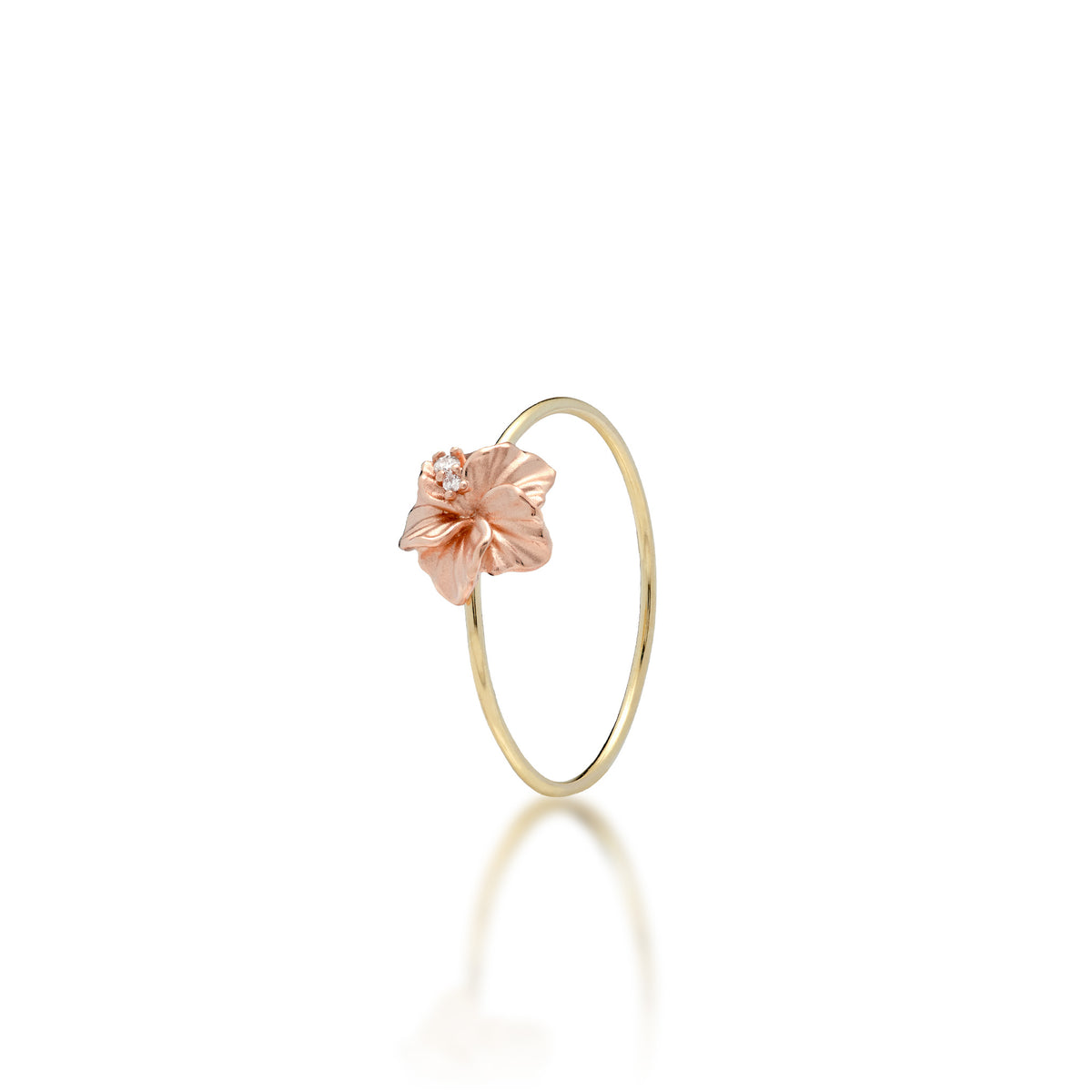 A 14k high-polish yellow gold ring with a satin finish rose gold hibiscus flower with diamonds, shown on a white background