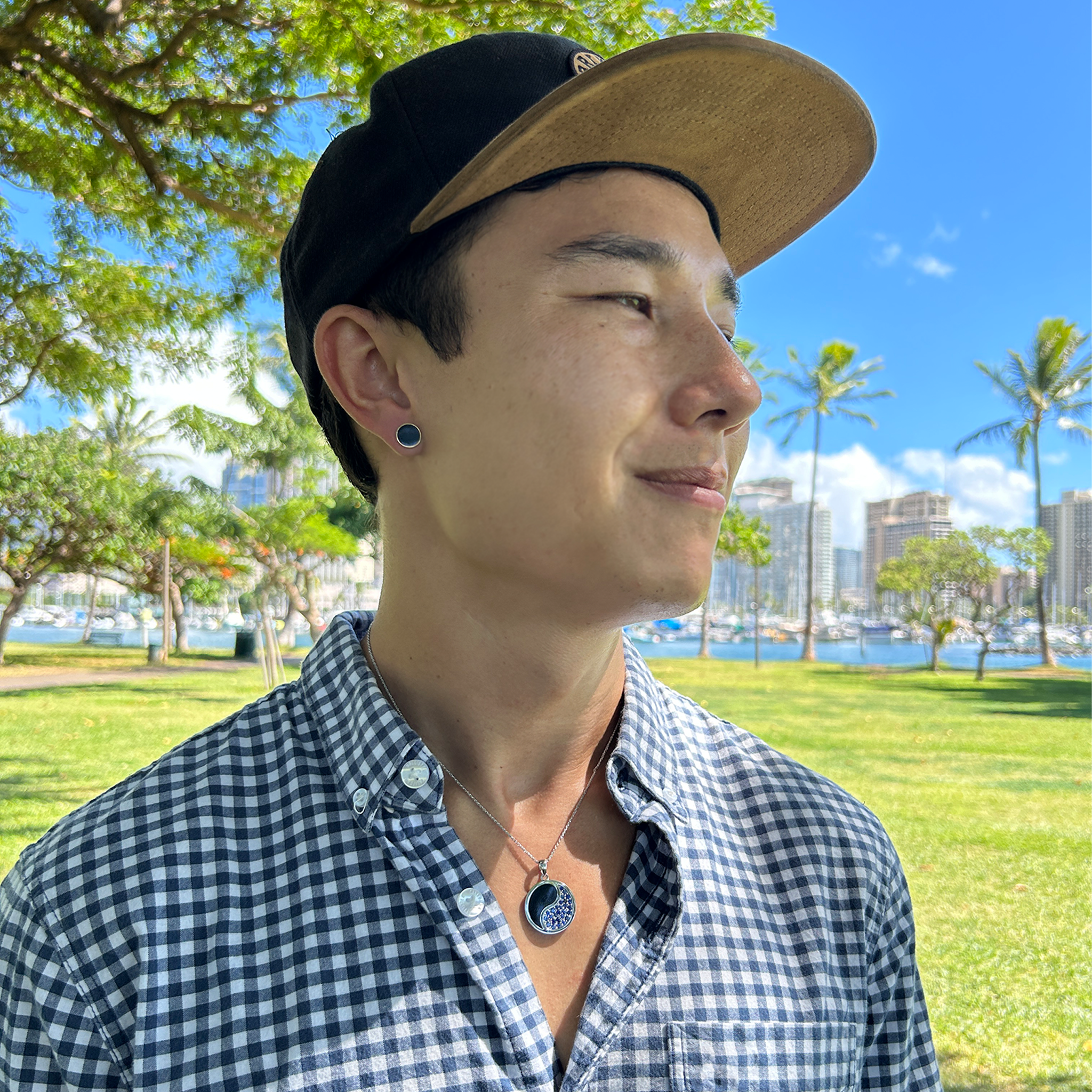 A man wearing a 16"-22" Adjustable 1mm Rope Chain in 14K White Gold with a Yin Yang pendant - Maui Divers Jewelry