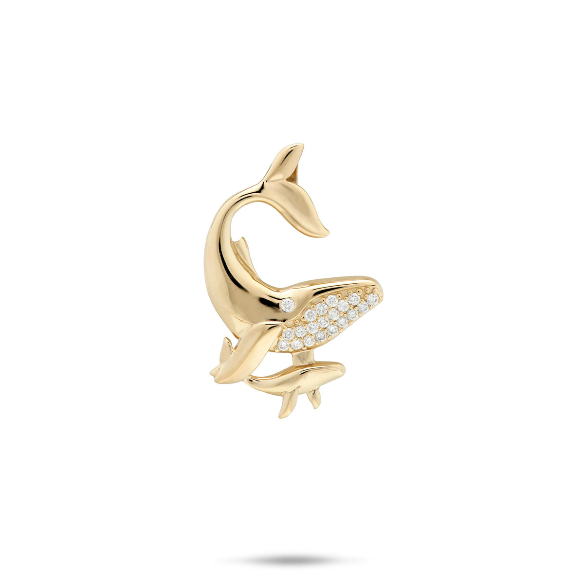 A 14k yellow mother and baby humpback whale pendant featuring one whale with a row of clear pavé-set stones on its belly and a small round stone on its eye, shown on a plain white background.