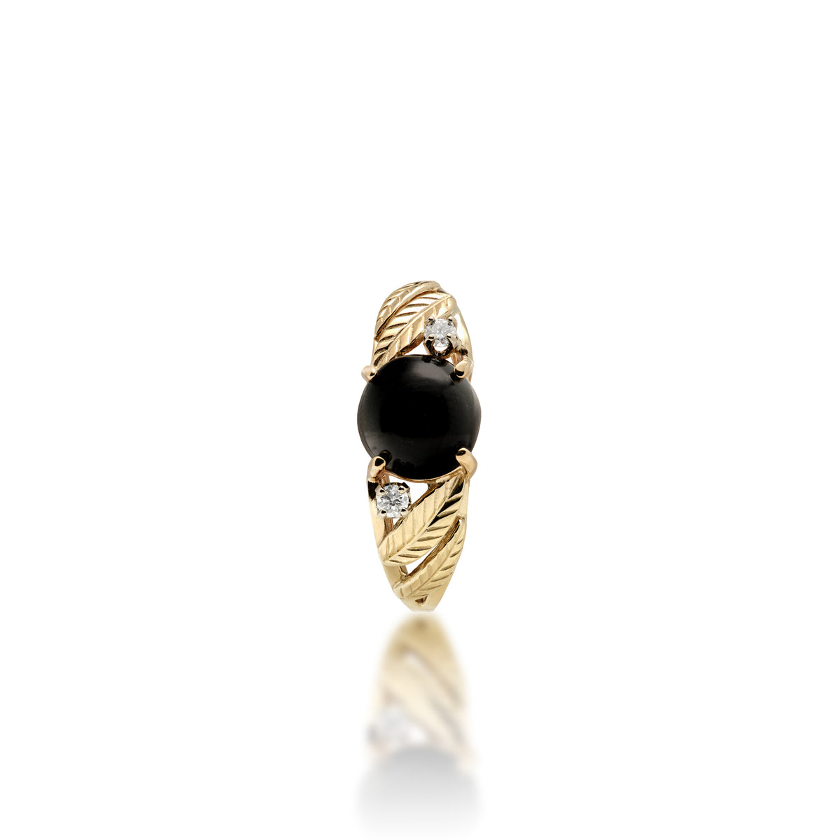 A top view of a 14k yellow gold ring with a round 7mm Hawaiian black coral gem at the crown, a diamond on each side, and diamond-cut maile leaves along the sides of the band, shown on a white background