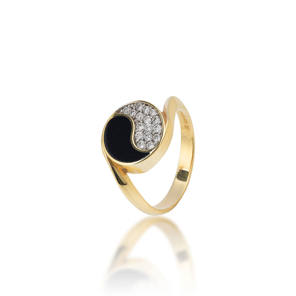 A 14k gold ring featuring a 12mm Yin Yang symbol with a Hawaiian black coral half and a pavé-set diamond half with white gold prongs, shown on a reflective white surface.