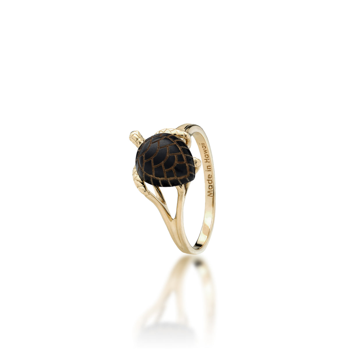 A 14k yellow gold Hawaiian green sea turtle ring with etched Hawaiian black coral as the shell and life-like high-polish gold detailing for the head and legs, shown on a white background