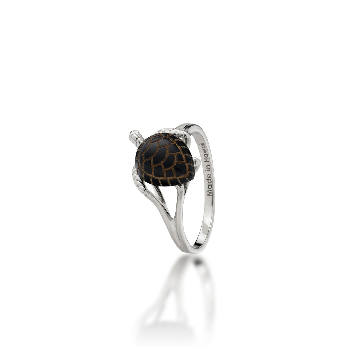 A 14k white gold Hawaiian green sea turtle ring with etched Hawaiian black coral as the shell and life-like high-polish gold detailing for the head and legs, shown on a white background