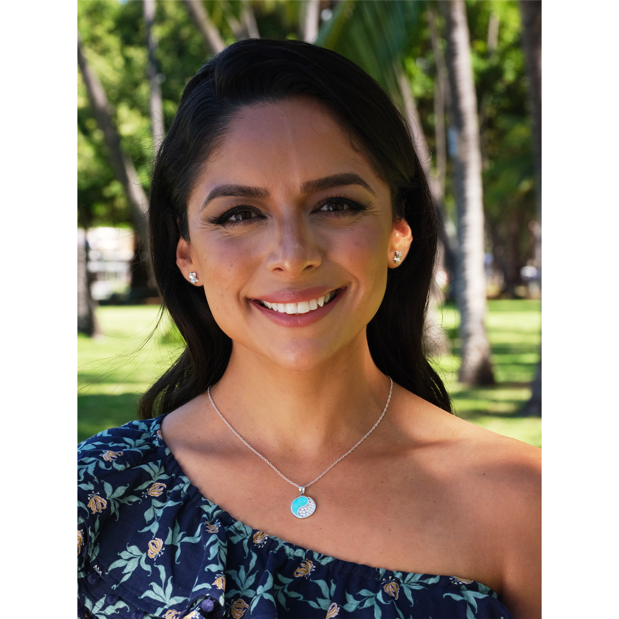 A woman wearing a Yin Yang Turquoise Pendant in White Gold with Diamonds - 18.5mm - Maui Divers Jewelry