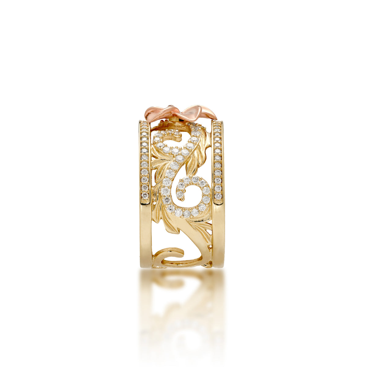 Side view of a 14k Yellow Gold Hawaiian Heirloom Ring with a 14k diamond-accented plumeria flower at the crown and diamond maile leaf and fern scrollwork with rows of diamonds on each side of the ring, shown on a white background