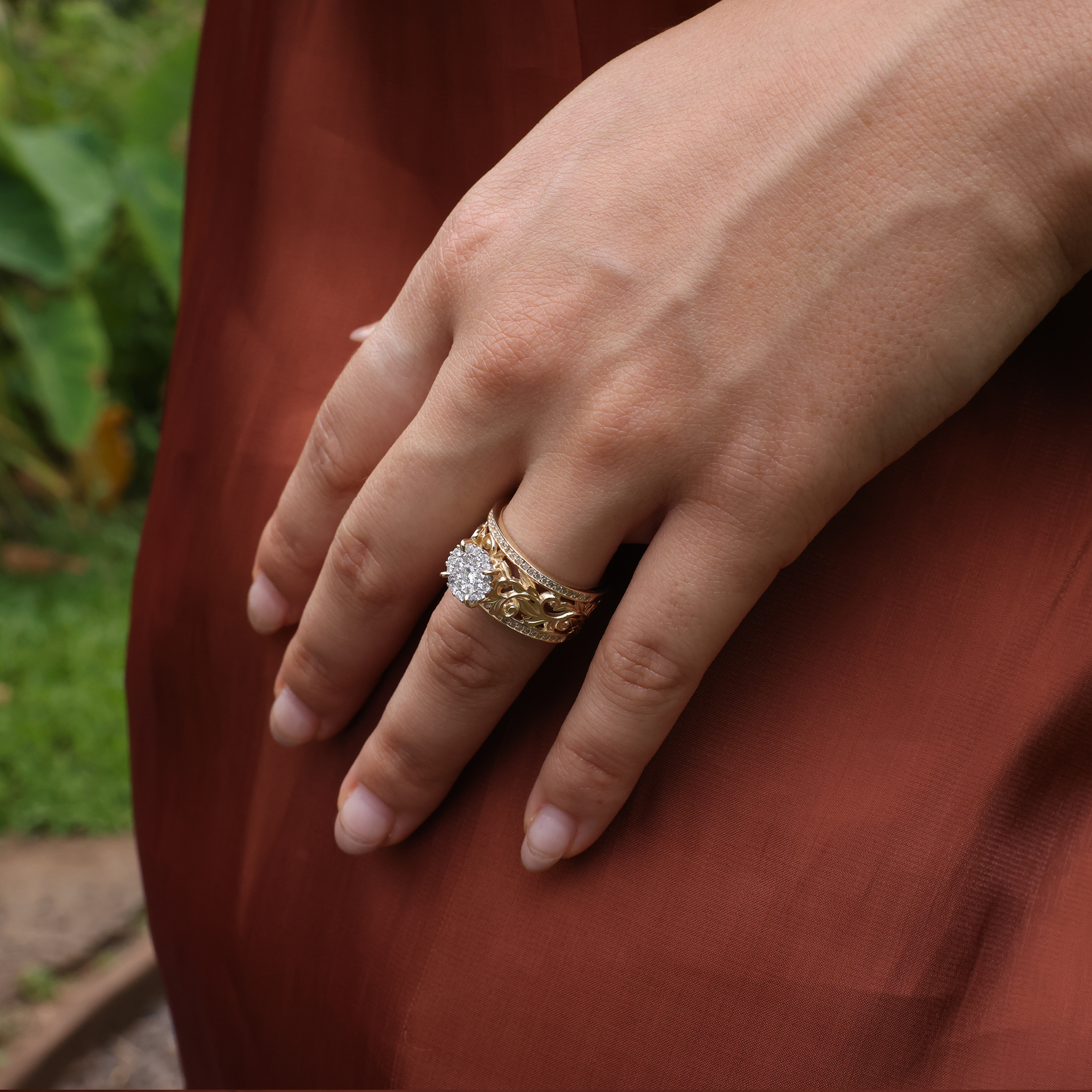 A woman's hand wearing a Living Heirloom Engagement Ring in Gold with Diamonds - 10mm - Maui Divers Jewelry