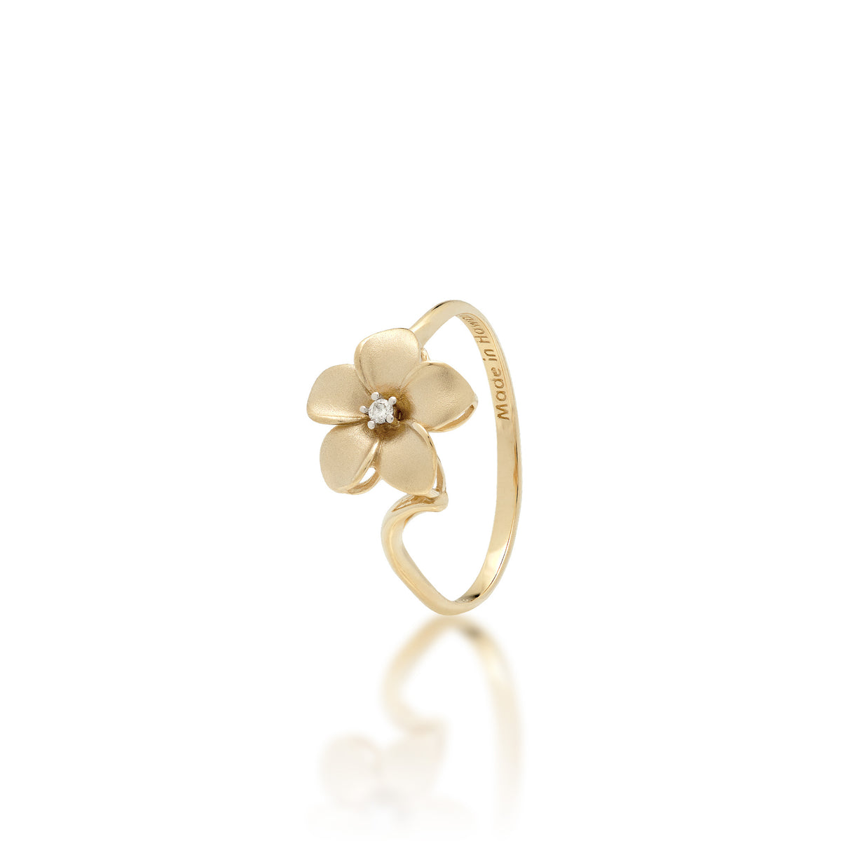 A 14k yellow gold plumeria flower ring with a diamond accent in the center and satin finished petals with high-polish edges, shown on a white background