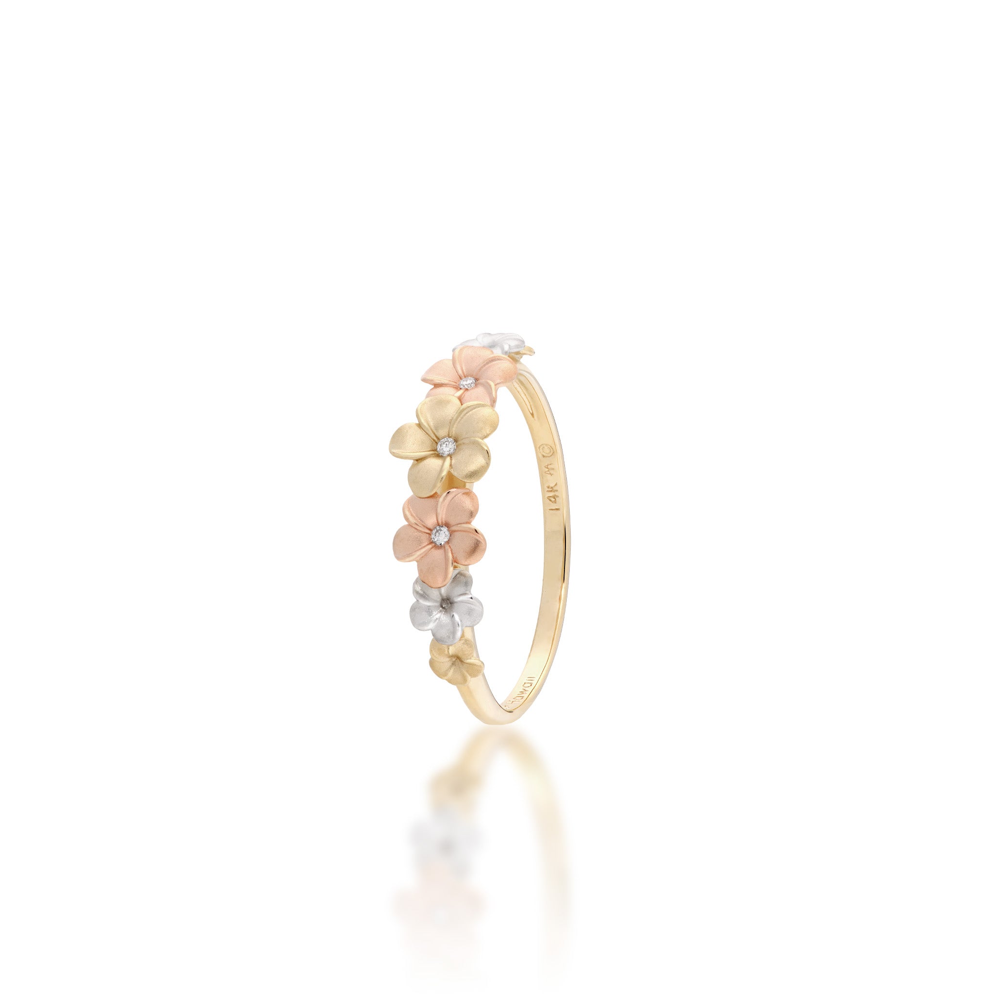Angle view of a Diamond Plumeria Ring in 14k Yellow, Rose, and White Gold on a white background