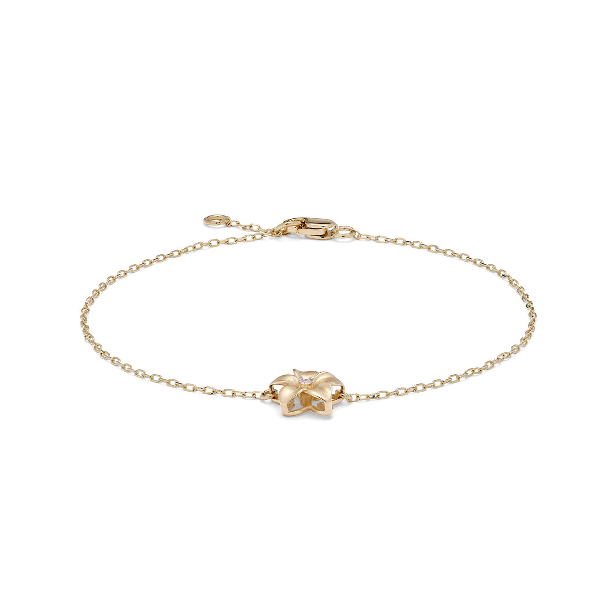 A 14k yellow gold chain bracelet with a 9mm diamond-accented plumeria, adjustable chain, and lobster claw clasp, shown on a white background