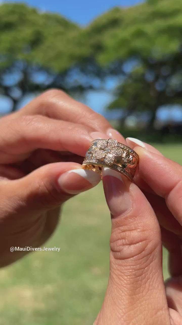 Video of a woman's hand wearing a Hawaiian Heirloom Plumeria Engagement Ring in Gold with Diamonds - 10mm - Maui Divers Jewelry