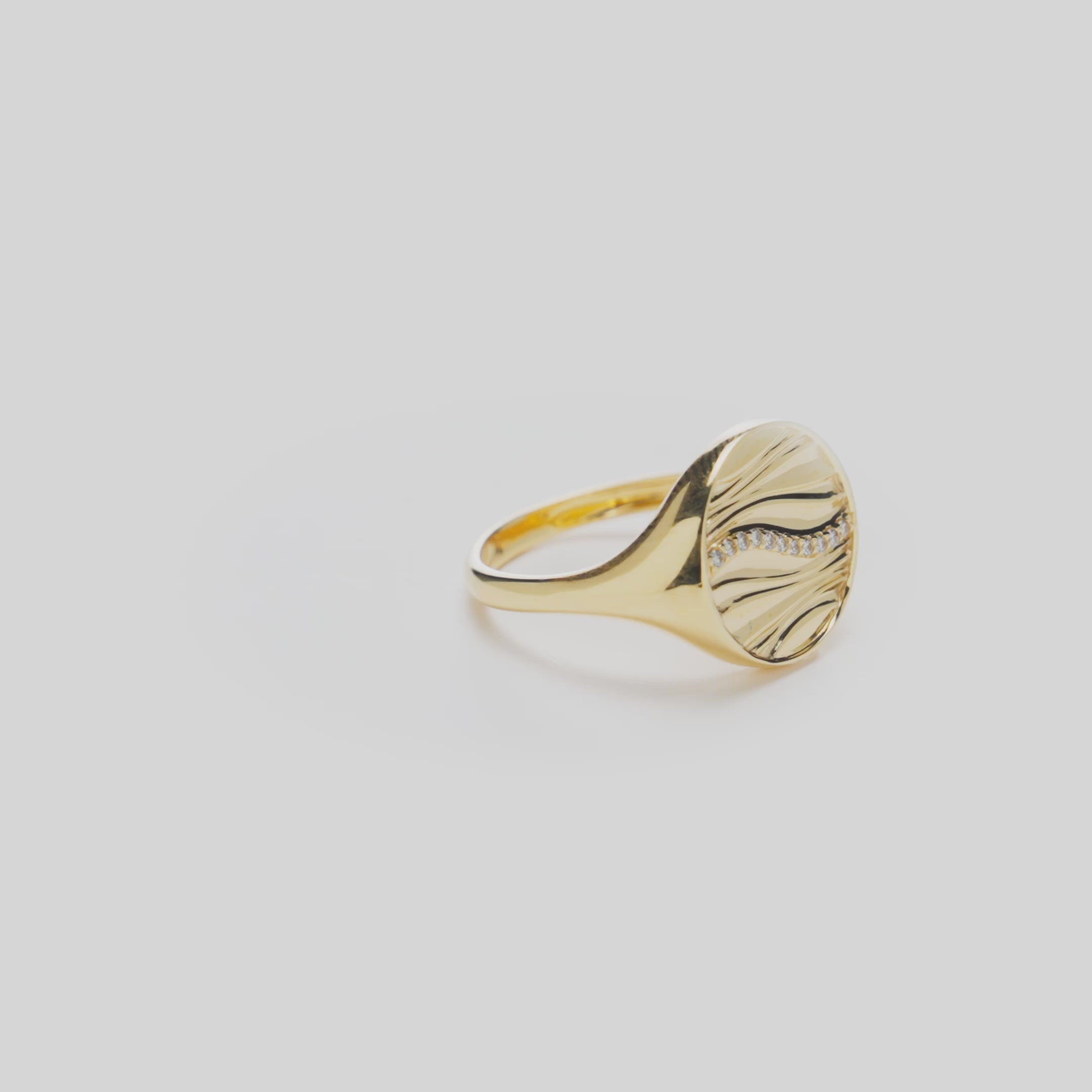 Vide of the Ocean Sand Signet Ring in 14k Yellow Gold with Diamonds on a White Background