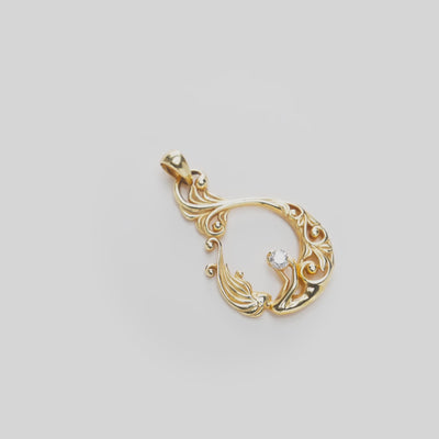 Living Heirloom Mermaid Pendant in Gold with Diamond on a white turntable