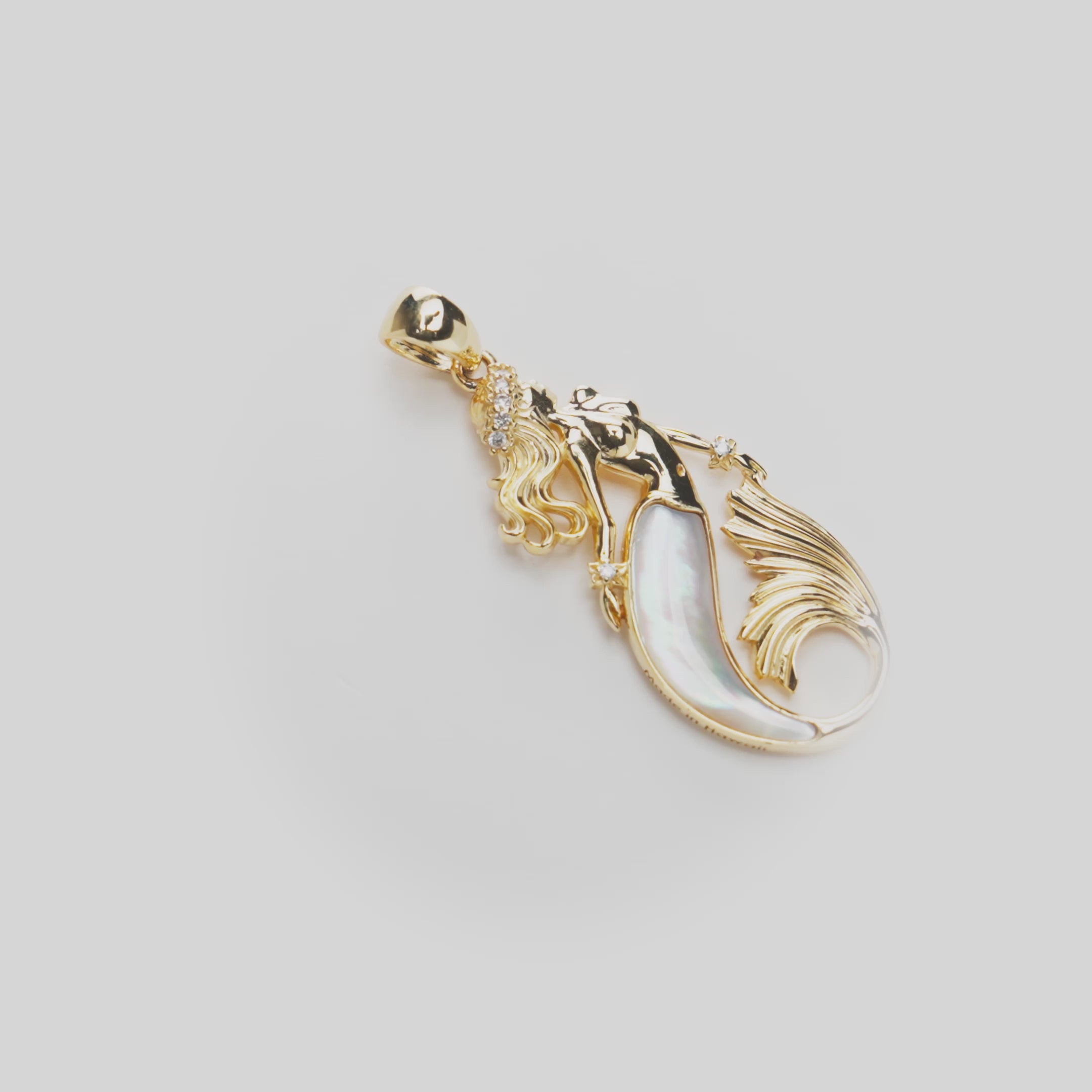 Sealife Mermaid Mother of Pearl Pendant in Gold with Diamonds on white turntable