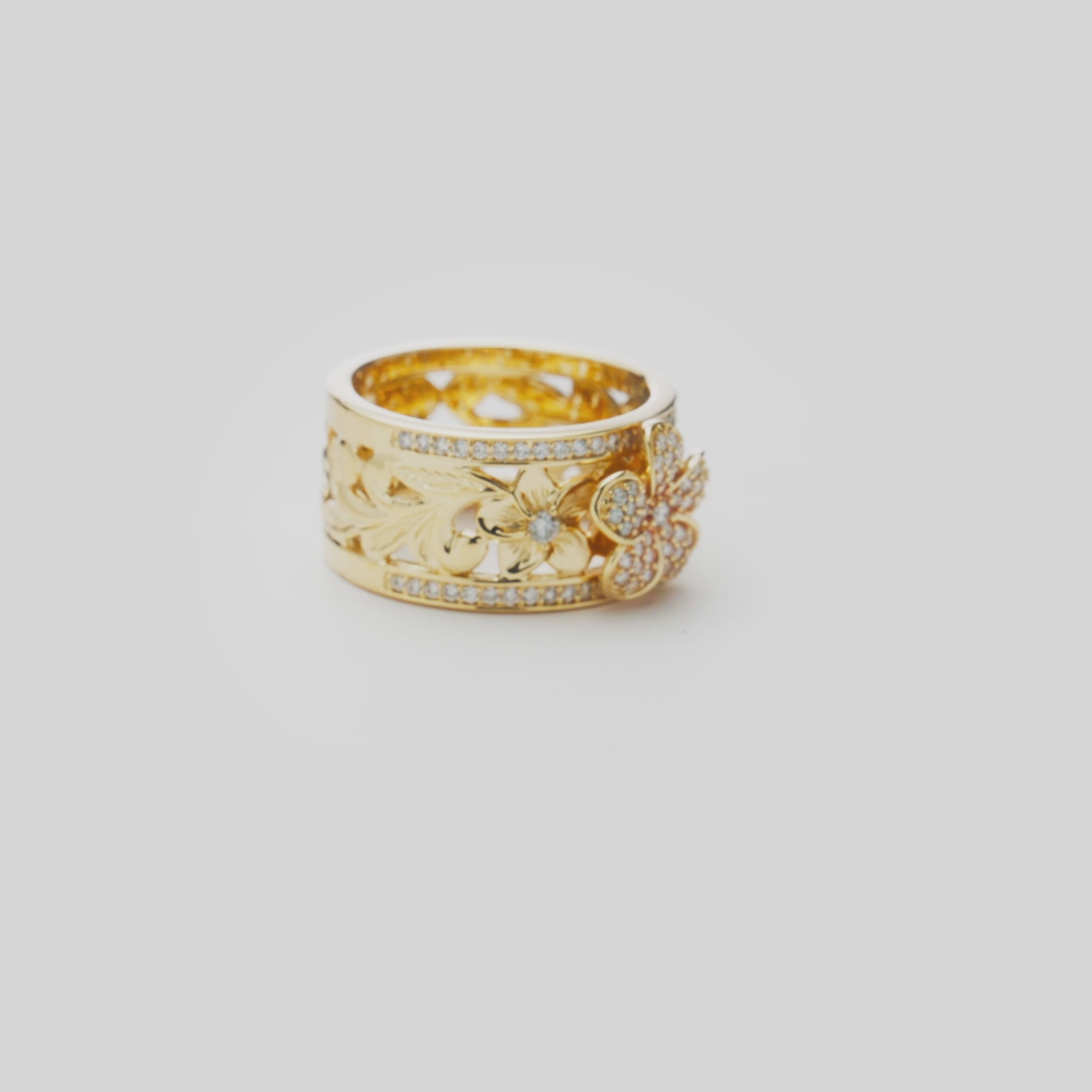 Video showcasing the 10mm Hawaiian Heirloom Plumeria Engagement Ring in 14k Yellow Gold with Diamonds